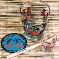 Mai Tai glass, shot glass, coaster, and bamboo straw with Tiki Kon artwork.